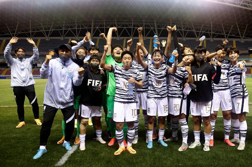 South Korean celebrate their win over Canada.