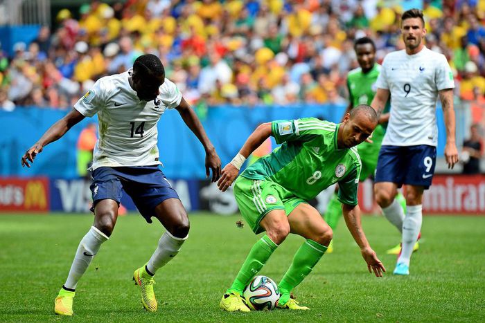 Osaze (m) in a match for Nigeria against France at the 2014 World Cup