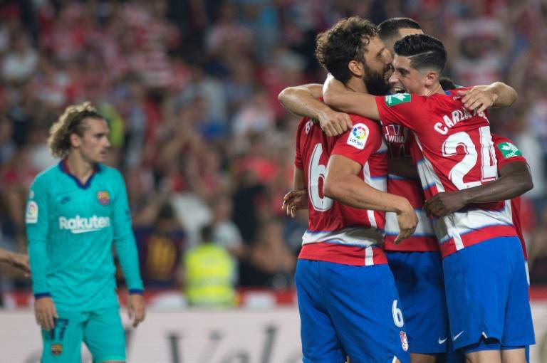 Granada players celebrate at the end of their stunning win over Antoine Griezmann and Barcelona