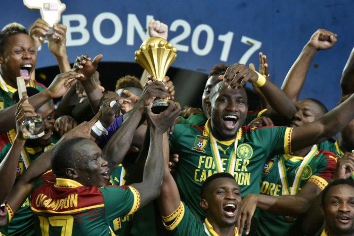 Cameroon's players celebrate with the winner's trophy after defeating Egypt 2-1 to win the 2017 Africa Cup of Nations, at the Stade de l'Amitie Sino-Gabonaise in Libreville, on February 5