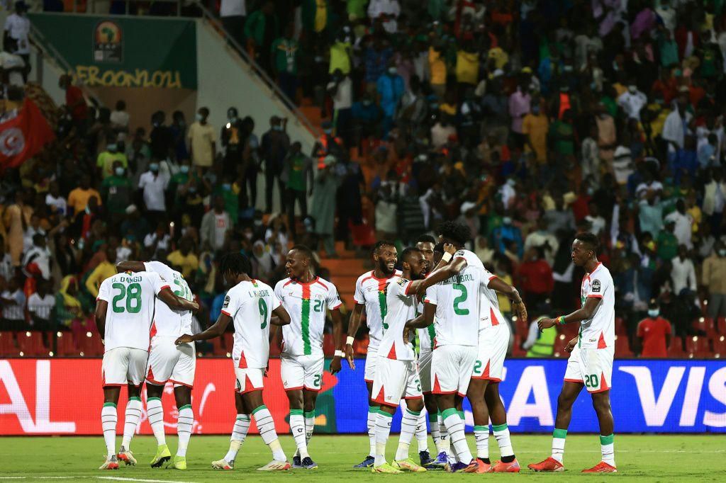 Burkina Faso players celebrate after Dango Ouattara scored against Tunisia in Garoua