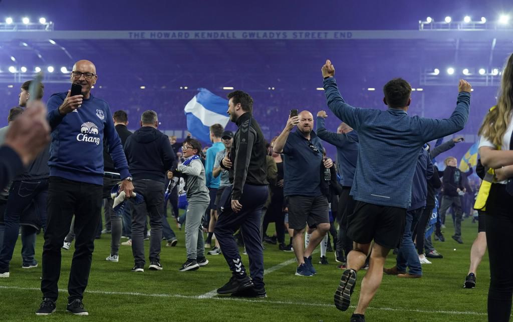 Everton fans invaded the pitch to celebrate escaping relegation
