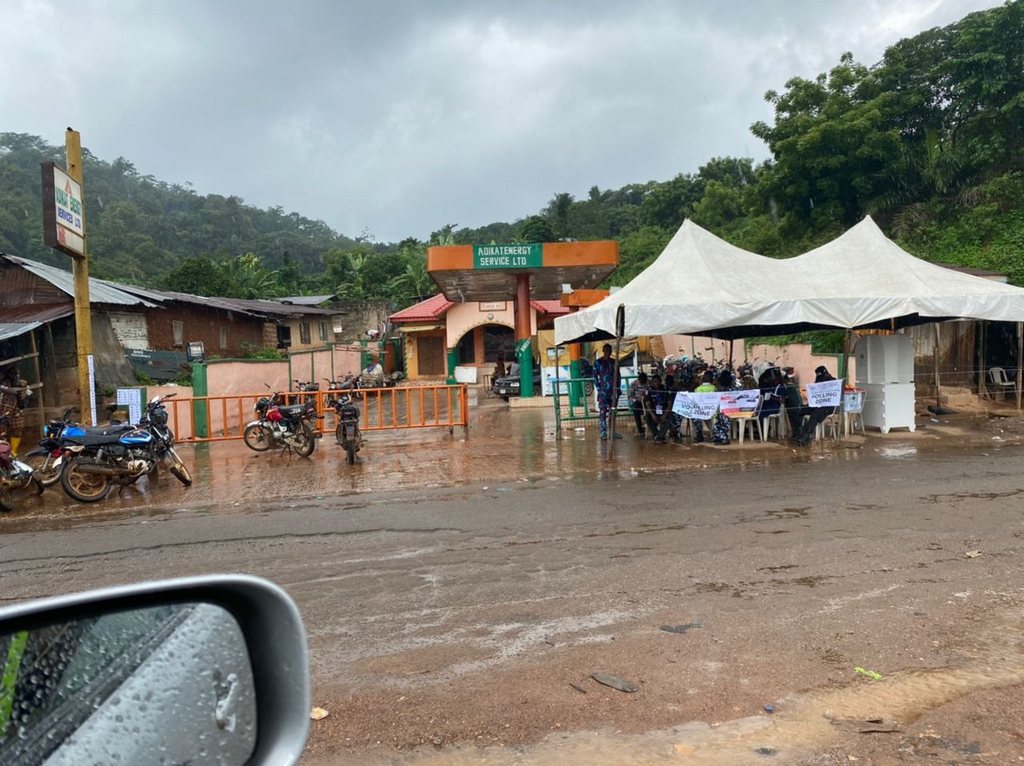Voters run for cover as rain pours down during election in Osun. [TheCable]