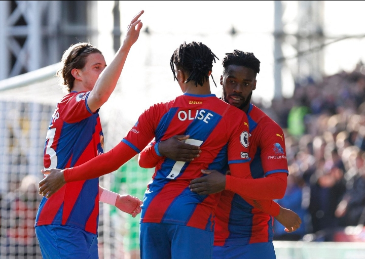 Olise celebrates with goalscorer Schlupp.
