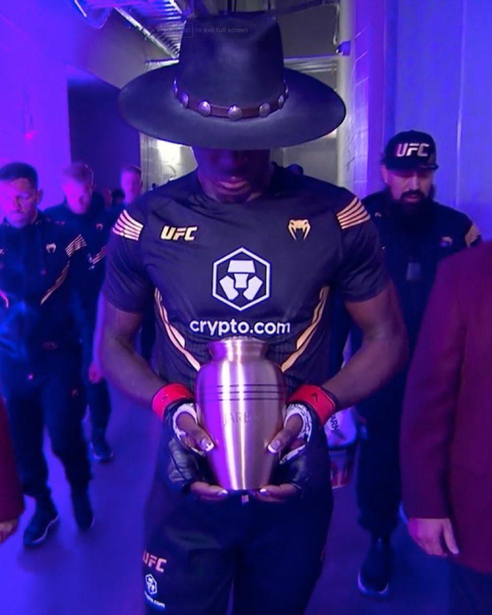 Reactions as Israel Adesanya walks out to the Undertaker theme song against Jared Cannonier