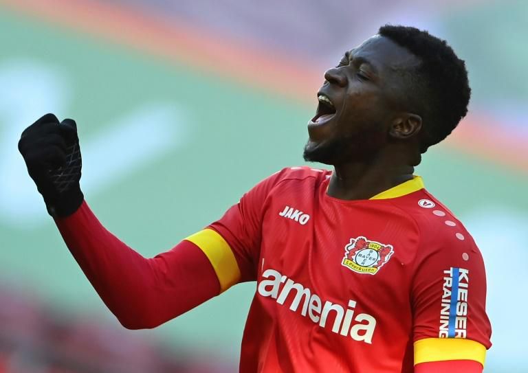 Leverkusen defender Edmond Tapsoba celebrates after scoring their last-gasp equaliser at Augsburg on Sunday