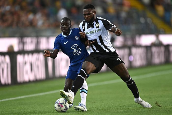 Isaac Success (R) contests for the ball with Chelsea's N'golo Kante (L)
