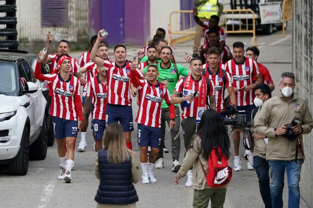 Atletico Madrid's players celebrate outside the stadium after winning the Spanish Liga Championship in Valladolid