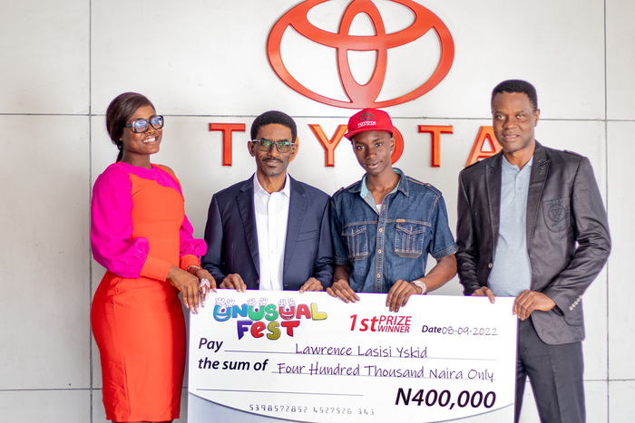 L-R  Convener of Unusual Fest, Alex Unusual; General Manager at Toyota Nigeria Limited, Bunmi Onafowokan; winner of Own-the-Dream Competition, Lawrence Lasisi Yskid; and Head of Services at Toyota Nigeria Limi