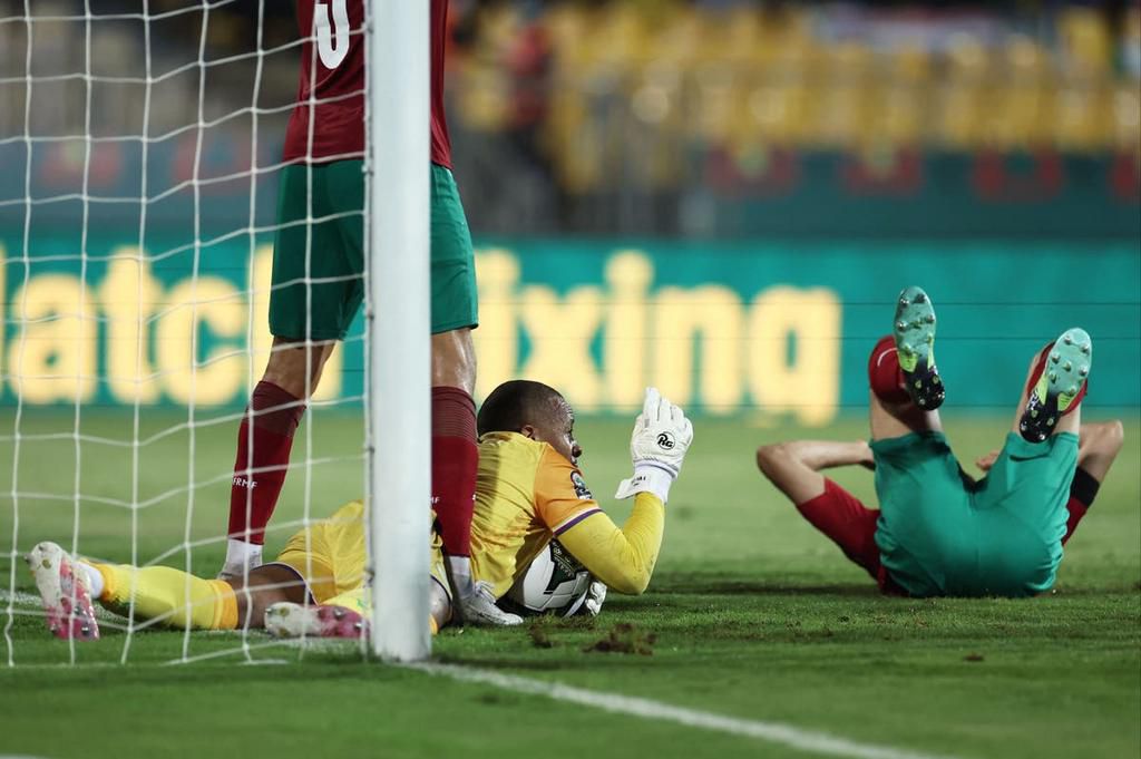 Comoros goalkeeper Salim Ben Boina makes a save against Morocco