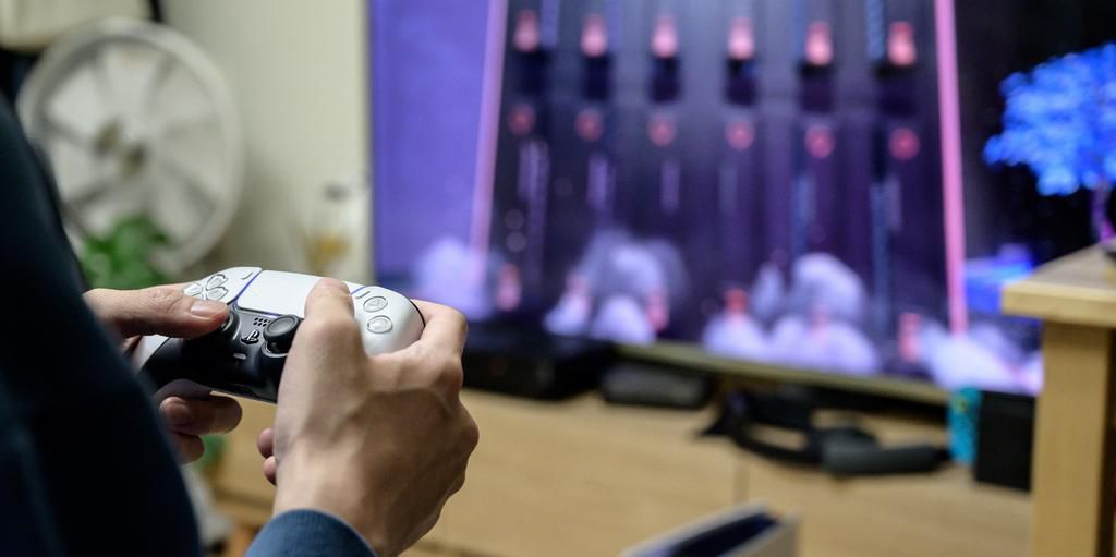 A gamer plays on the new Sony Playstation PS5 at his home in Seoul.