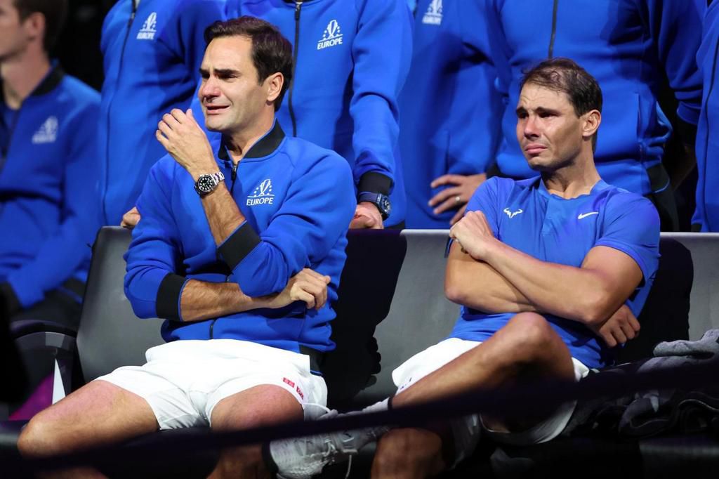 Roger Federer and Rafa Nadal crying while holding hands together at Federer's farewell