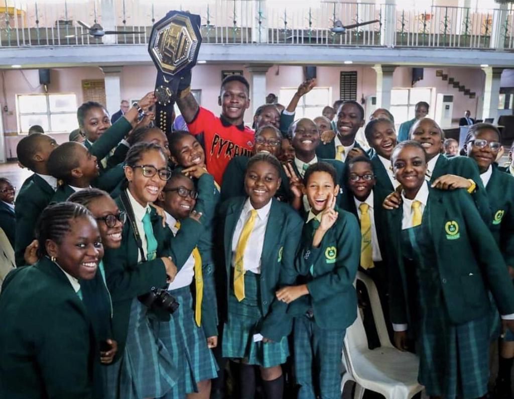Adesanya returned to his old school Chrisland to celebrate his UFC title in 2019
