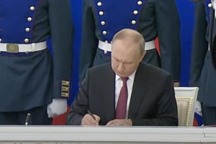 Russian President Vladimir Putin signs annexation documents in Moscow, Russia, on September 30, 2022.
