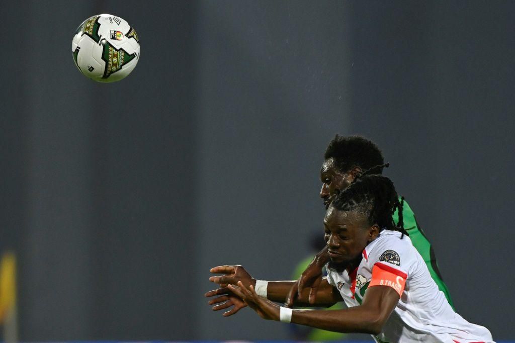 Burkina Faso captain Bertrand Traore (front) fights for the ball with Amanuel Yohannes of Ethiopia during an Africa Cup of Nations Group A match in Bafoussam on Monday.