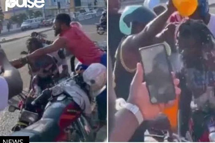 Okada riders bathe colleague