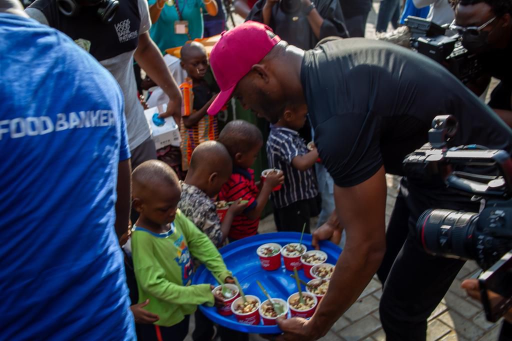 Champion and family man, Kamaru Usman shares an unforgettable CSR experience, feeds 1000 children