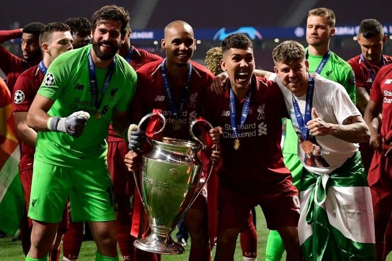 Liverpool players celebrate after beating Tottenham Hotspur in last season's Champions League final in Madrid
