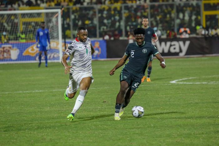 Ola Aina of Nigeria and Jordan Ayew of Ghana during the 2022 World Cup Qualifier between Ghana and Nigeria