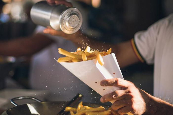 Adding table salt to food