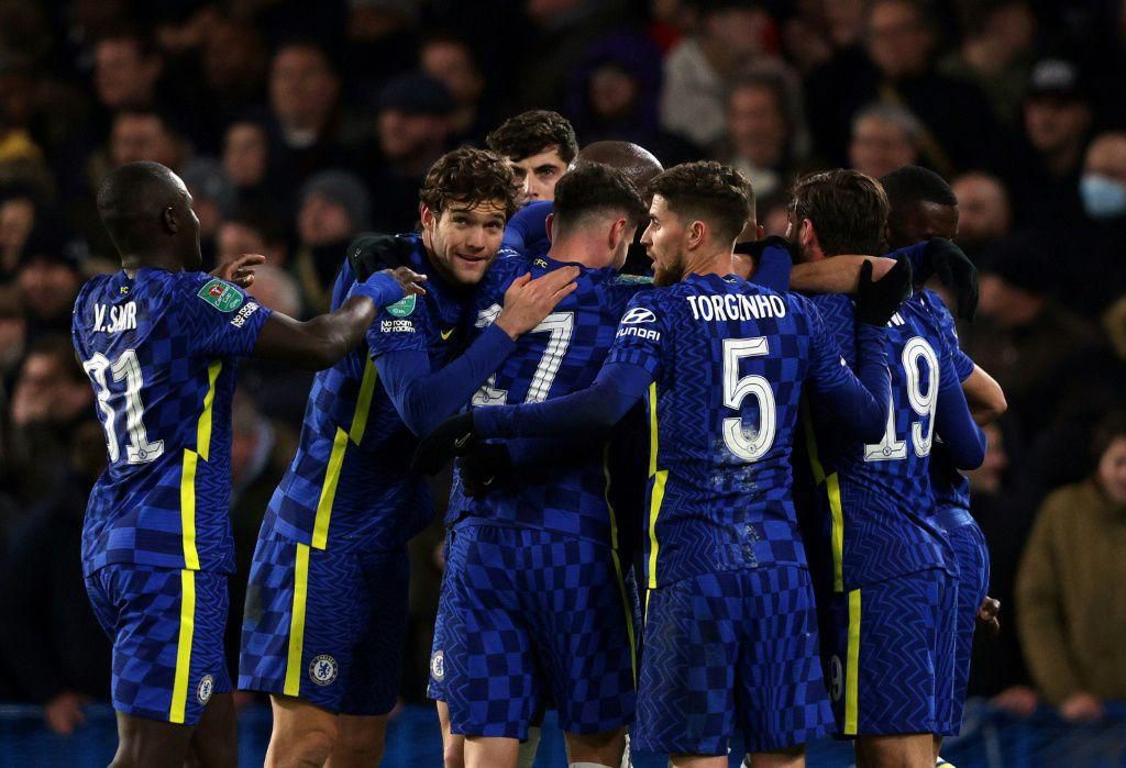 Chelsea players celebrate after scoring against Tottenham
