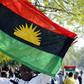 An IPOB supporter holding a Biafran flag