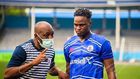 Rivers United's star Rafiu Kayode Isaq taking instructions from his coach.