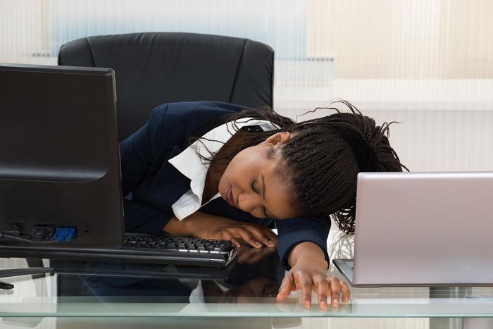 Tired woman at work(Medium)