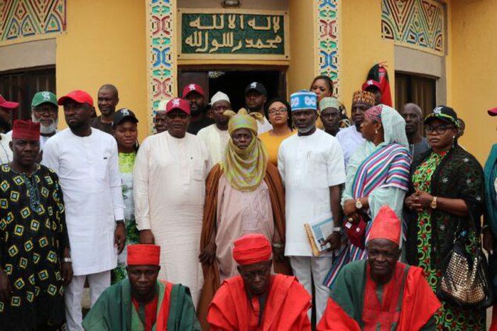 City Boys Movement and National Coalition Group members in group photograph with Mai Girma, the Sapeyi of Garki, Abuja, Dr Usman Ngakupi. [NAN]