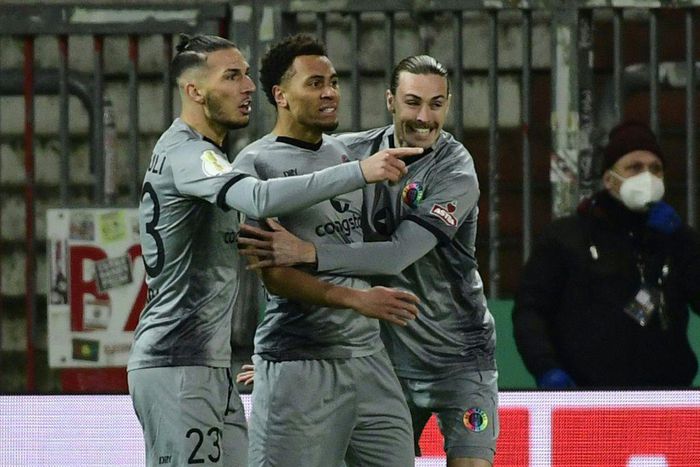 St Pauli forward Etienne Amenyido (C) celebrates scoring against Dortmund inn the German Cup