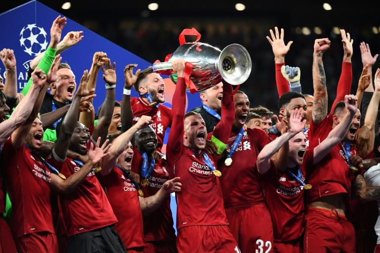 Liverpool captain Jordan Henderson lifts the Champions League trophy