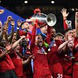 Liverpool captain Jordan Henderson lifts the Champions League trophy