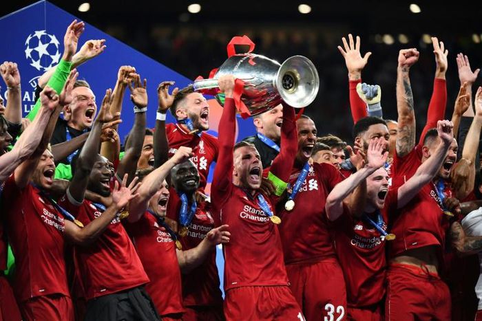 Liverpool captain Jordan Henderson lifts the Champions League trophy