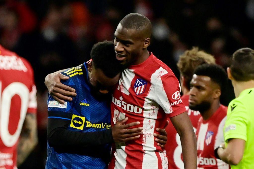 Move closer: Manchester United's Anthony Elanga (left) pictured with Atletico Madrid's Geoffrey Kondogbia