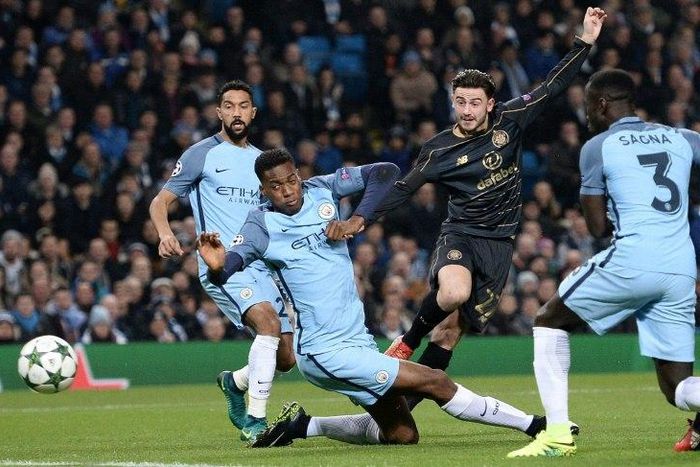 Patrick Roberts shoots past Manchester City's Oluwatosin Adarabioyo to score for Celtic at the Etihad Stadium in Manchester on December 6, 2016