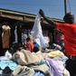 A man selling used or thrift clothes {wealthresult}