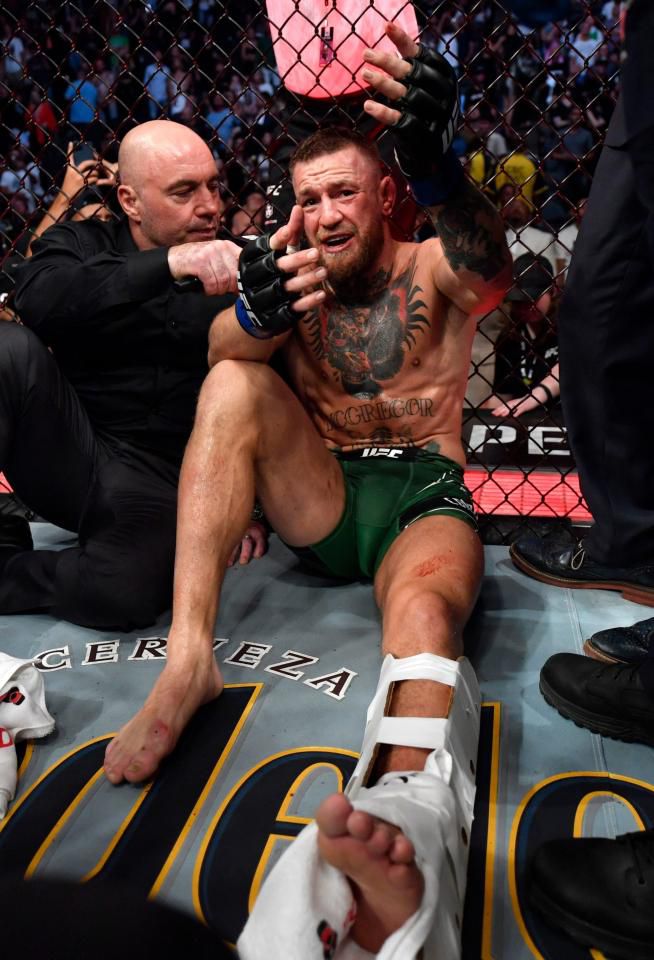 Mcgregor with his left leg in a cast after his fight with Dustin Poirier