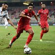 Algeria captain Riyad Mahrez (L) is pursued by  Equatorial Guinea defender Saul Coco during an Africa Cup of Nations Group E match in Douala on Sunday