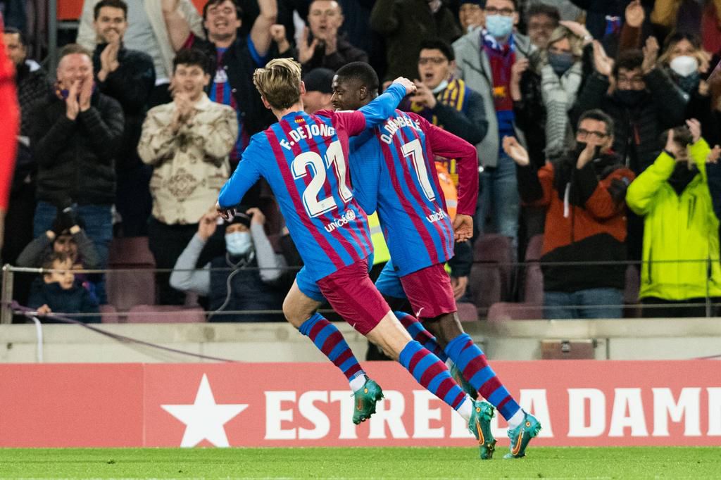 Frenkie de Jong celebrating Barcelona's second goal with Dembele