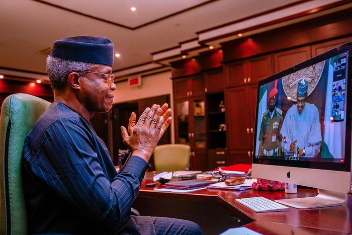 Vice President Yemi Osinbajo applauds President Buhari who chaired the 12th Bola Tinubu Colloquium (Tolani Alli)