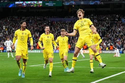 Chelsea players led by Marcos Alonso celebrate going ahead in the UEFA Champions League Quarter-Final match against Real Madrid