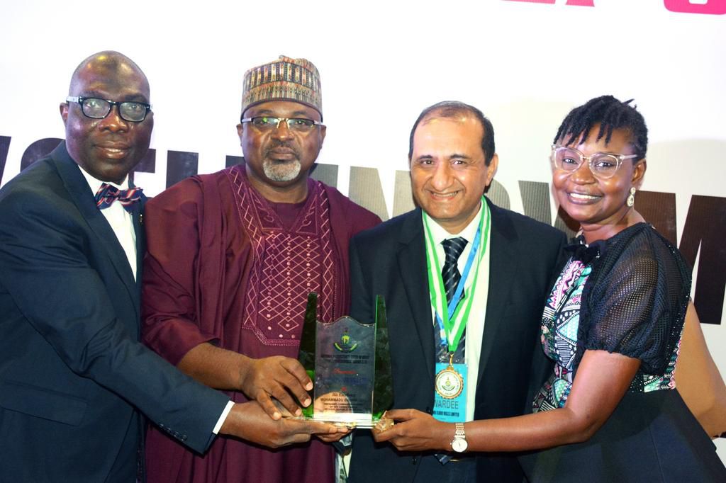 L-R: Head, Human Resources, Moshood Quadri; Head Corporate Affairs and Government Relations, Datti Danjuma; Managing Director, Ashish Pande; all of Crown Flour Mill (CFM) Limited; and Corporate Affairs Manager, Olam Nigeria, Damilola Adeniyi, displayin...