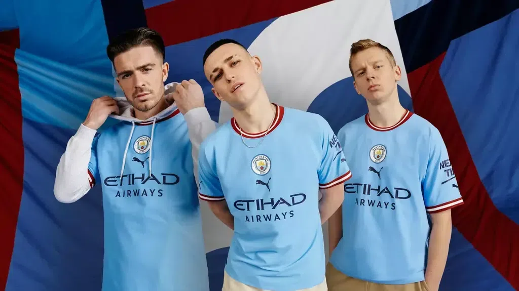Jack Grealish and Foden models Manchester City's new home kit