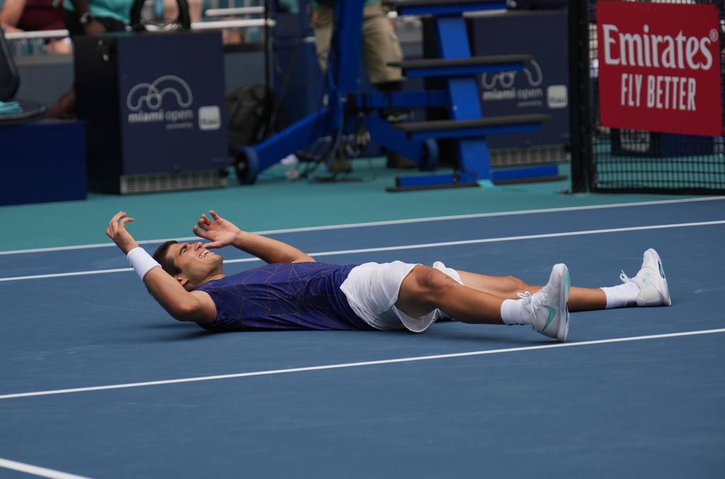Alcaraz fell to the floor in celebration