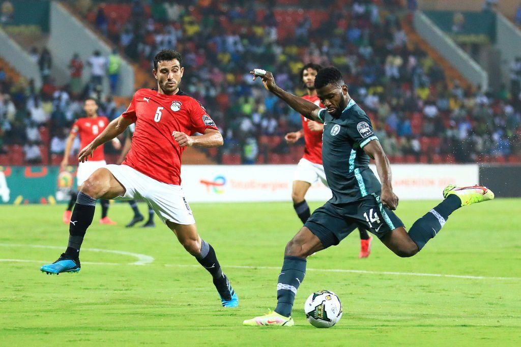 Egypt defender Ahmed Hegazy (L) attempts to block a shot by Nigeria forward  Kelechi Iheanacho during an Africa Cup of Nations Group D match in Garoua on Tuesday.