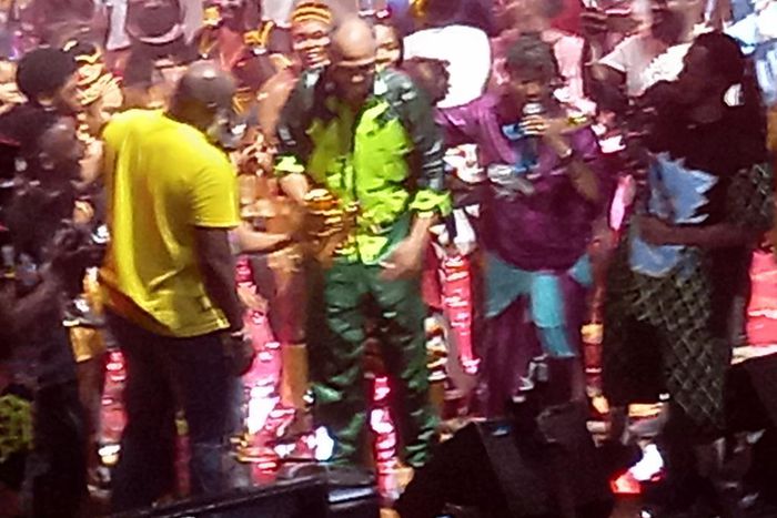 Femi Kuti receving the present from his family