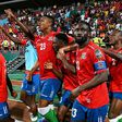 Gambia substitute Ablie Jallow (3R) celebrates with teammates after scoring the goal that beat Tunisia in an Africa Cup of Nations Group F match in Limbe on Thursday