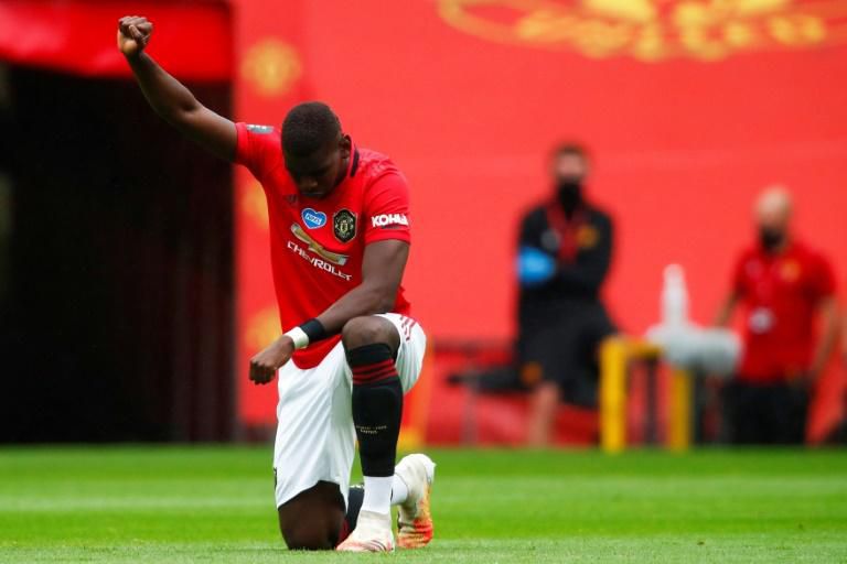 Manchester United's Paul Pogba takes a knee in support of the Black Lives Matter movement