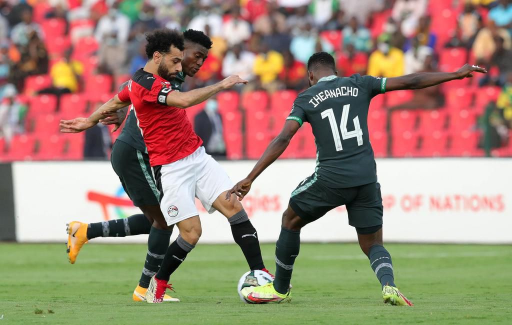 Mohamed Salah (centre) tries to fight off Taiwo Awoniyi and Kelechi Iheanacho of Nigeria (Twitter/@PoojaMedia)