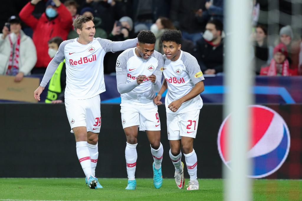 Chukwubuike Adamu (middle) celebrates with Karim Adeyemi(Right) and RB Salzburg teammate after scoring the opener against Bayern Munich in the Champions league Roun d of 16 fixture on Wednesday night
